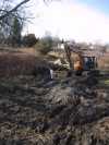 Laying the conduit in the hydro trench.